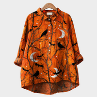 Blusa naranja con pájaros